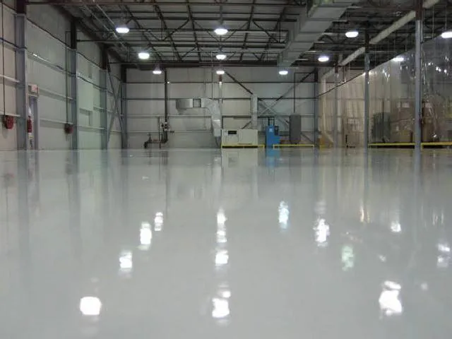 Glossy epoxy floor installed by AES in a large hangar