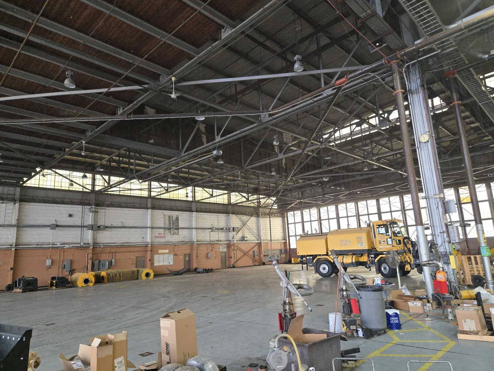 AES PFAS remediation job inside an aircraft hangar with equipment on the floor
