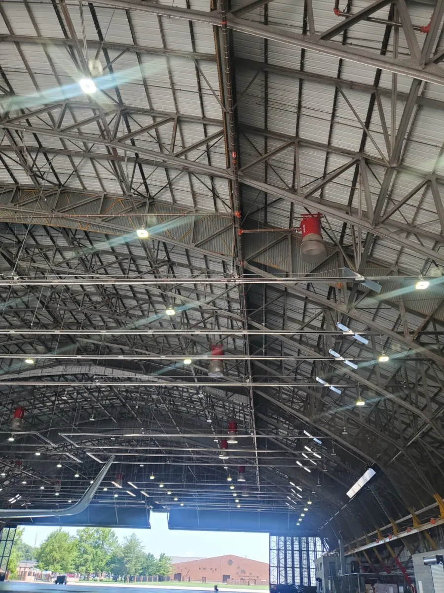 Steel roof structure inside a large aircraft hangar on an AES PFAS job